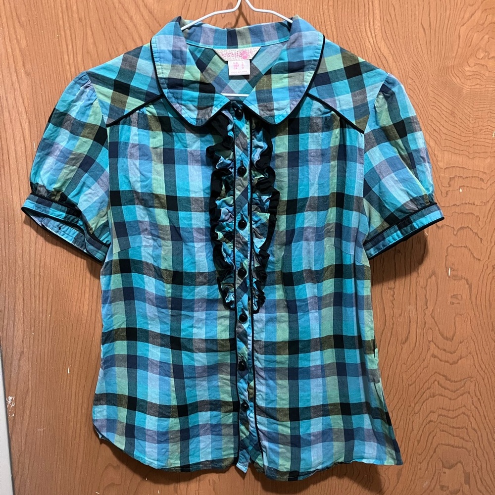 Cute checkered button down with front ruffle in blue, green, and black